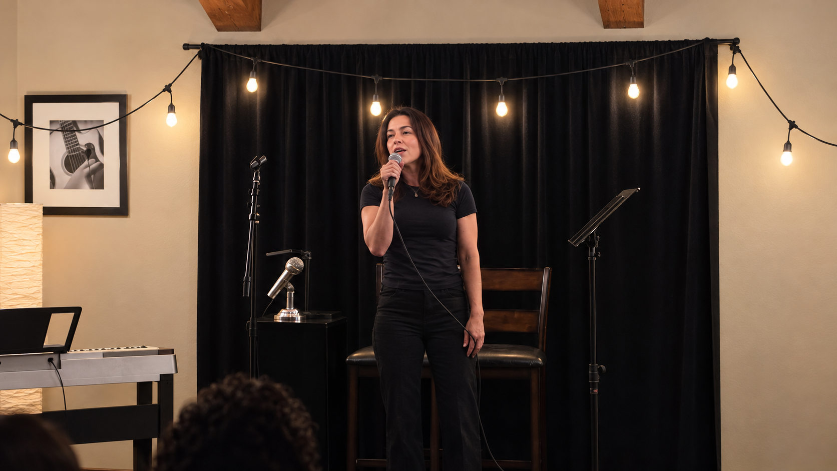 A singer sharing music at a studio open mic